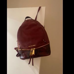 Michael Kors maroon snakeskin backpack (color: oxblood)